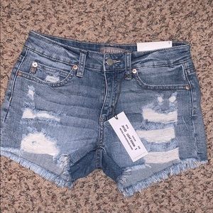 Low rise light wash distressed shorts